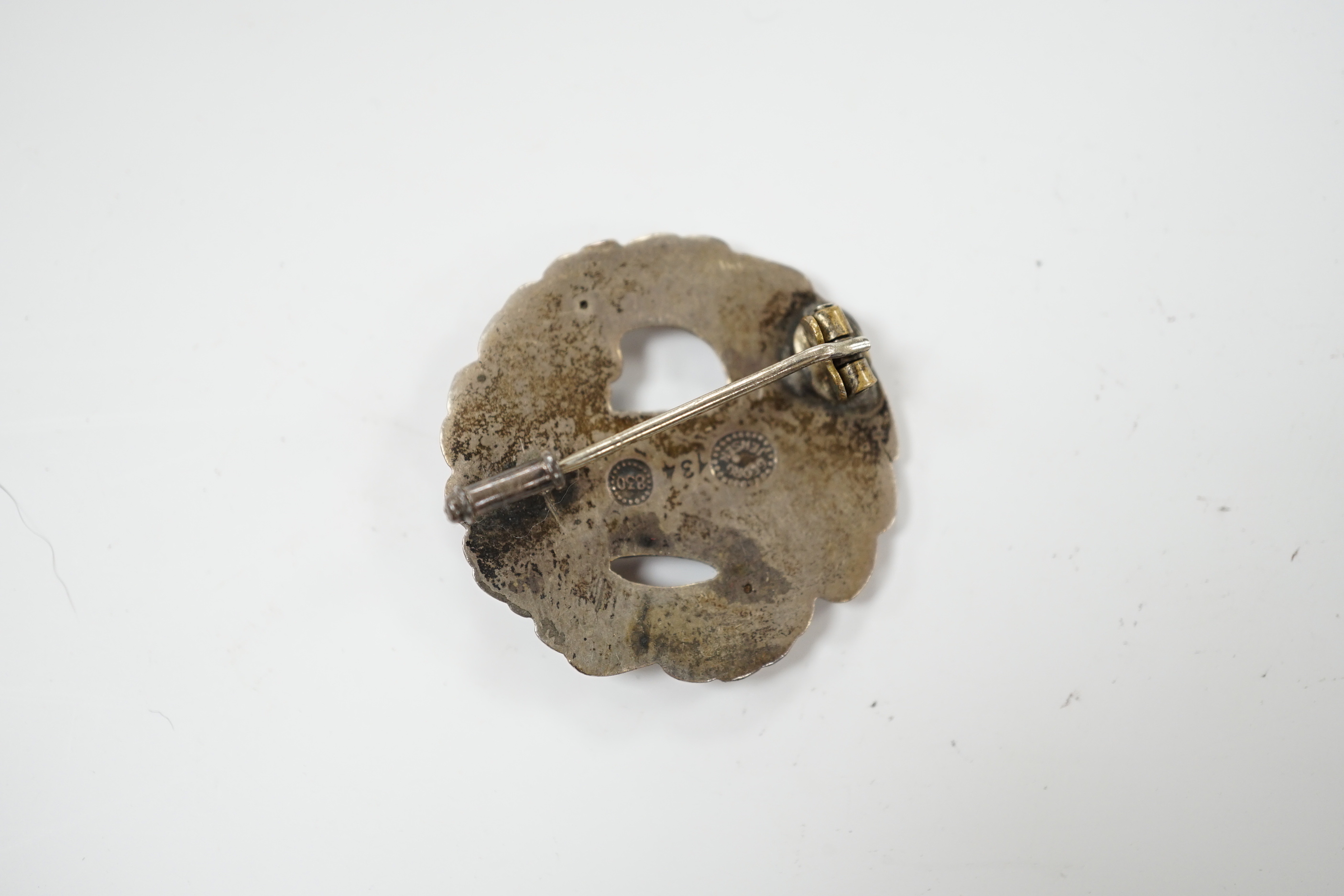 A Georg Jensen 830 standard bird and wreath brooch, design no. 134, 30mm.